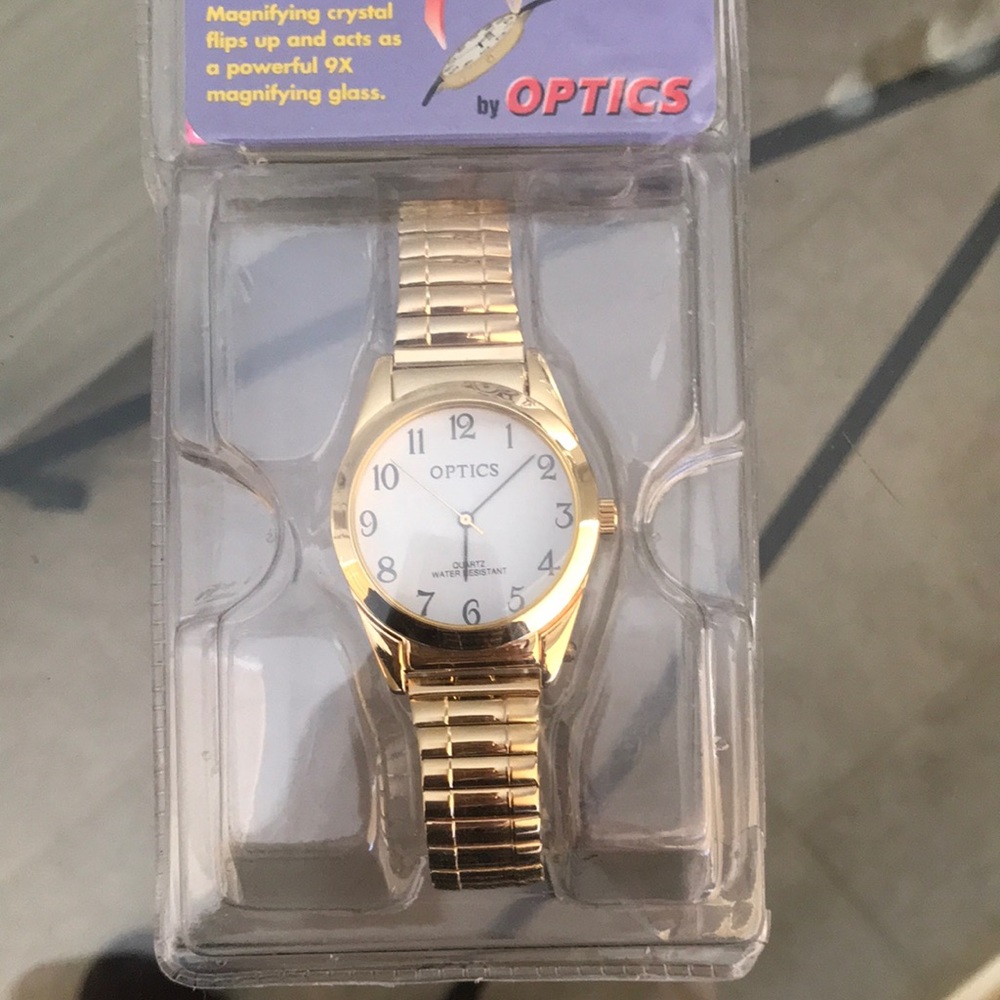 Optics quartz watch. Gold stretchy band,‎ magnifying crystal NEW classic